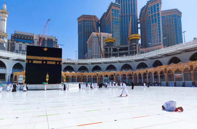 Pilgrims in Kaaba in Macca al Haram - umrah Covid 19 coronavirus restrictions face mask